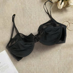 Black bra on a textured surface with flowers