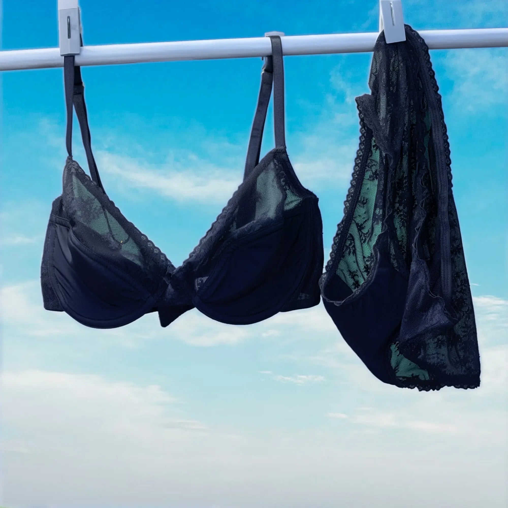 Black lingerie set hanging on a clothesline