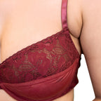 Red lace bra on a neutral background