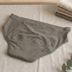 Charmella Period Panty on a beige surface.