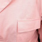 Close-up of a pink pj set's pocket on a garment
