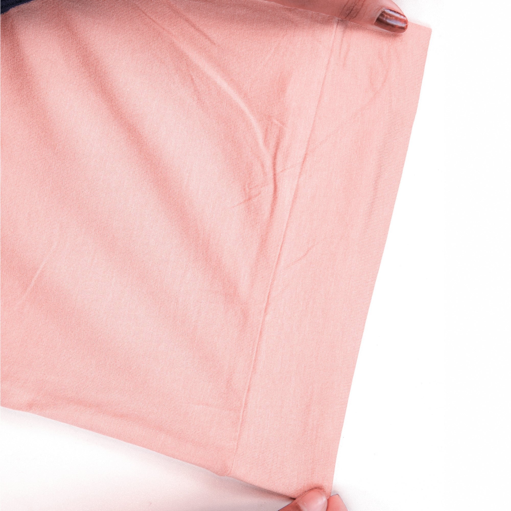 Close-up of a pink pj set fabric with a white background