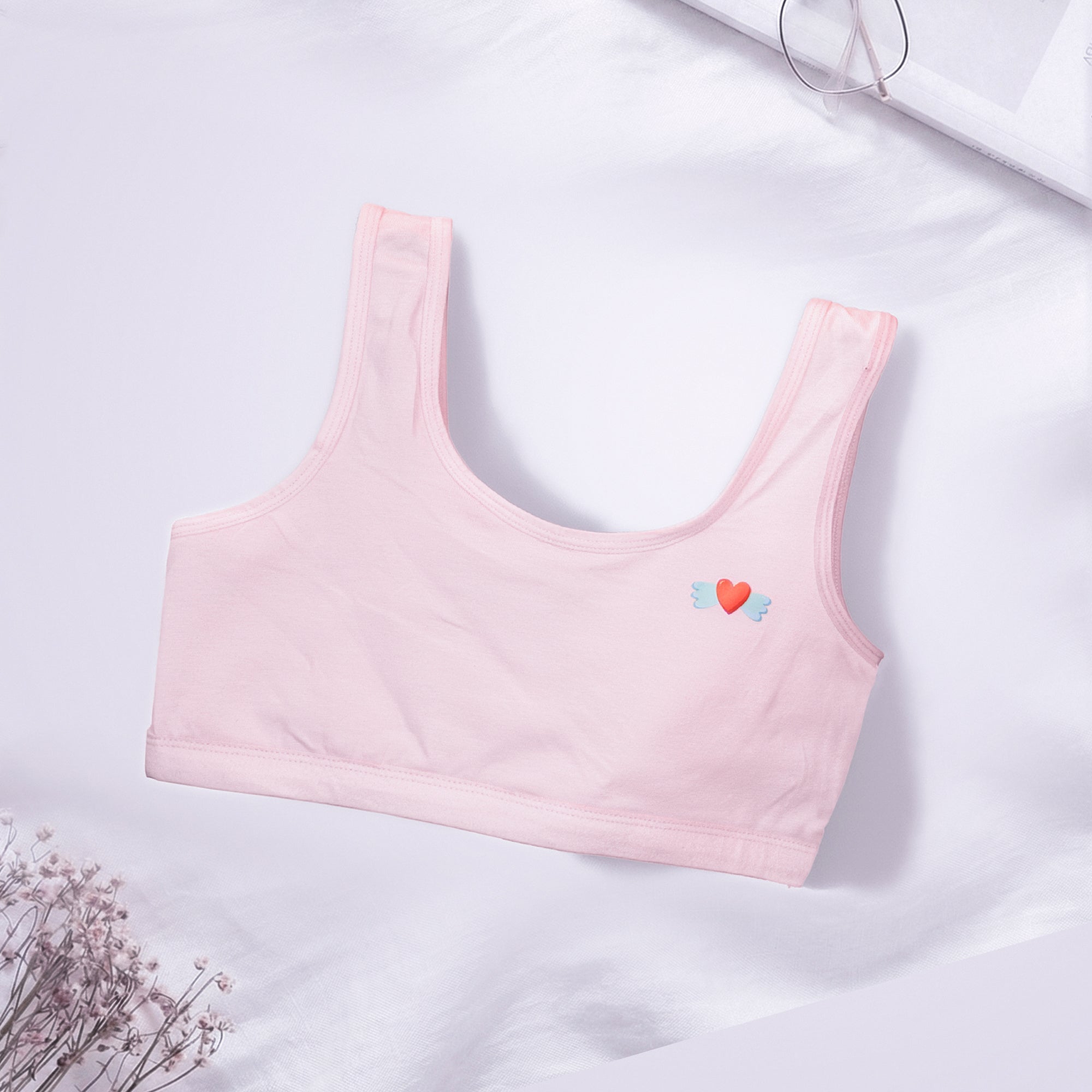 Pink Charmella Slip-On Bra with heart designs.