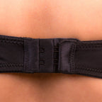 Close-up of a Charmella T-Shirt Bra belt being worn on a person's waist.