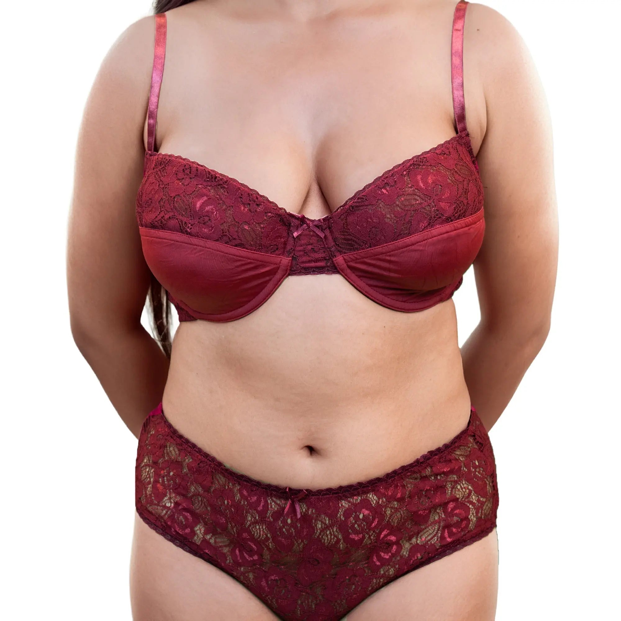 Red lace lingerie set on a white background